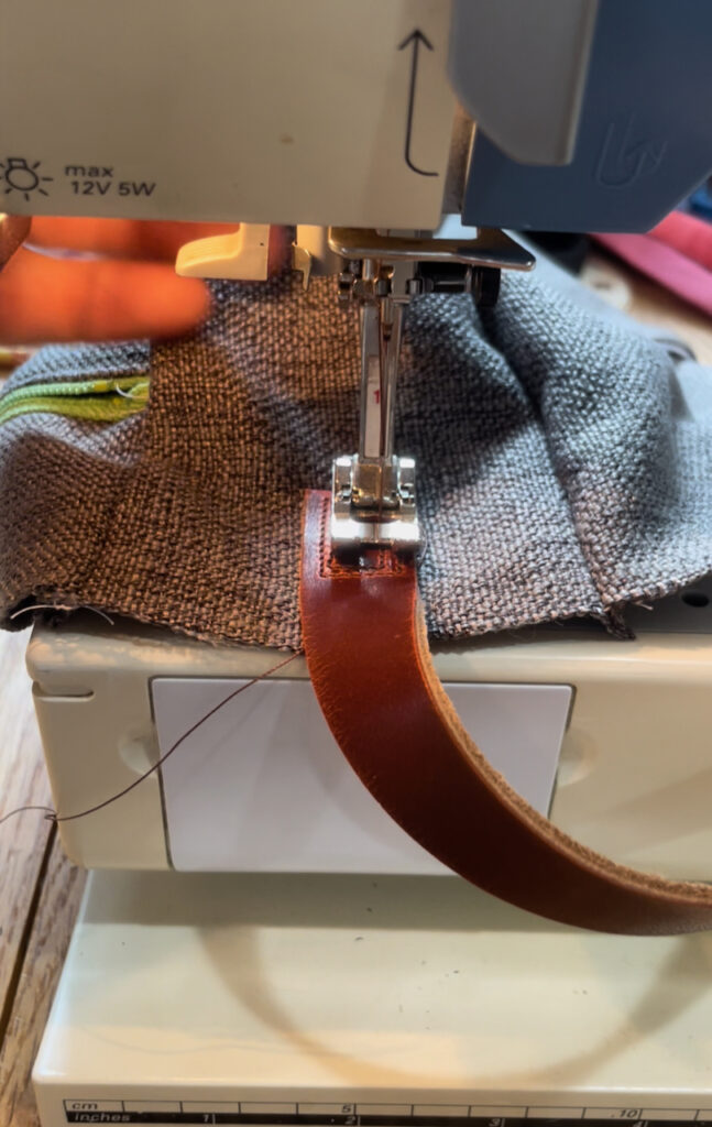 sewing a leather handle in place